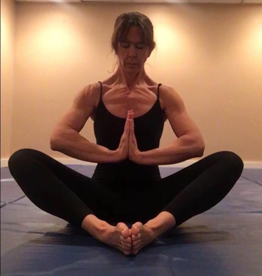 Melissa Verdi, survivor of childhood sexual abuse, in a yoga pose